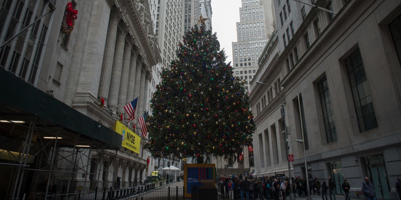 The Dow hit another record high as the S&P 500 still fell short of record territory.