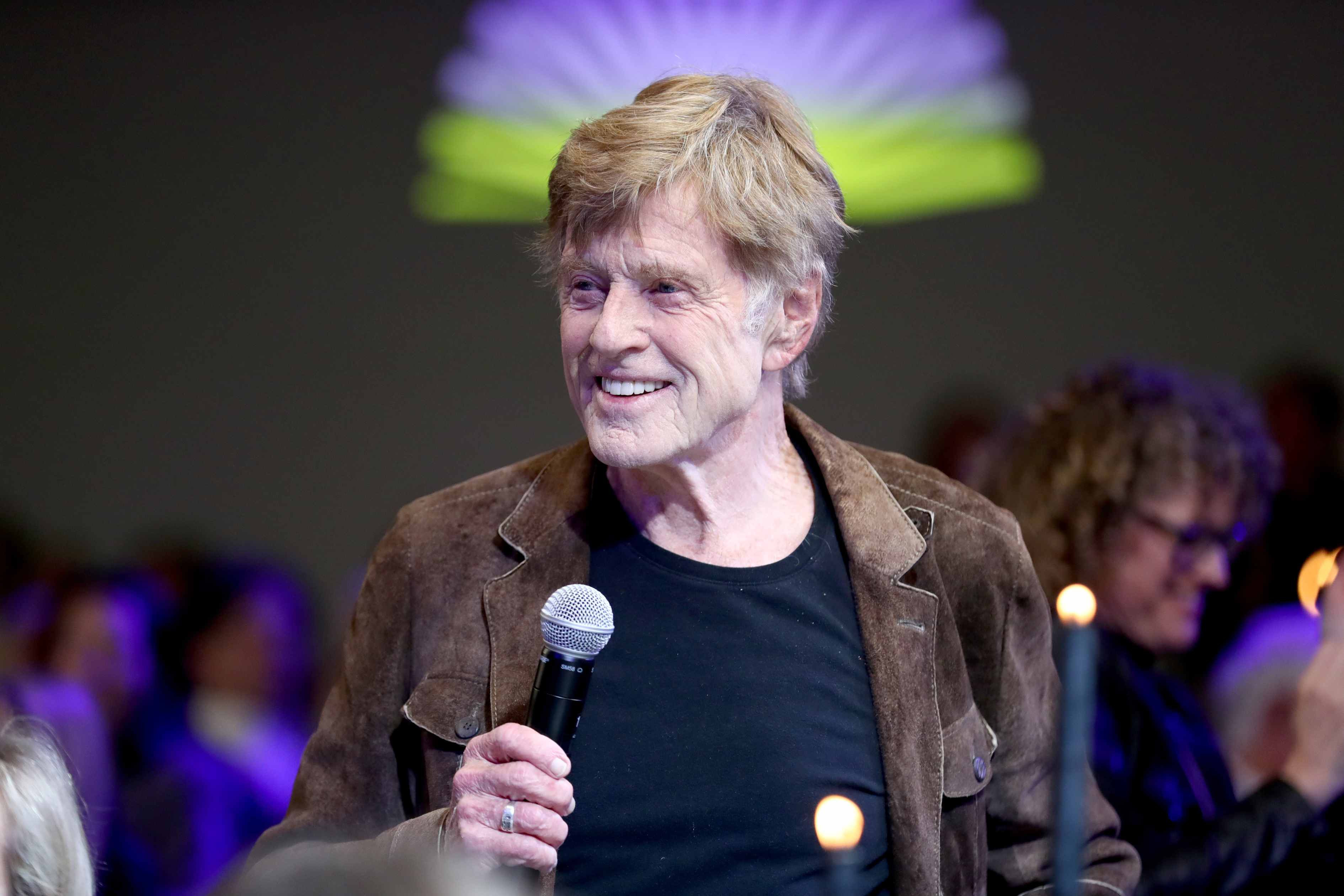 Robert Redford speaking at an event.