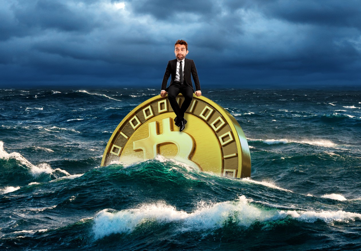 Illustration of a man in a suit sitting on a large Bitcoin coin in a stormy sea.