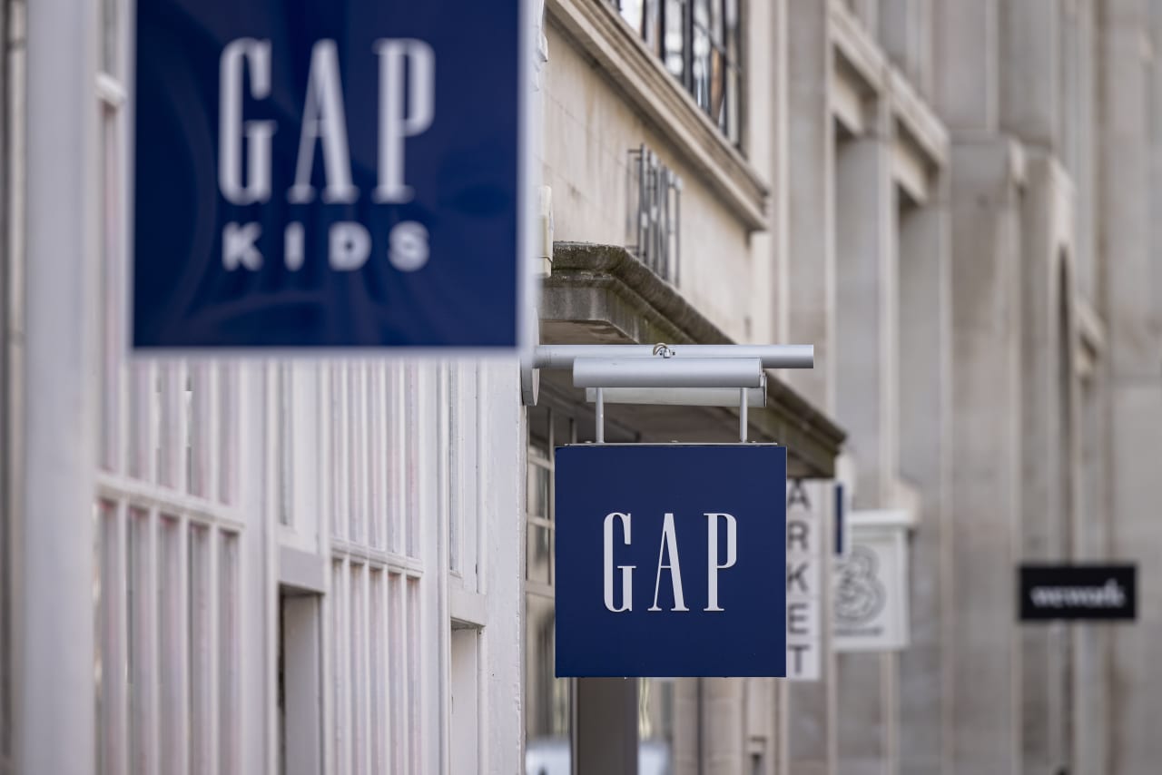 Shares of Gap rose 23% as the retailer returned to profit and raised guidance.