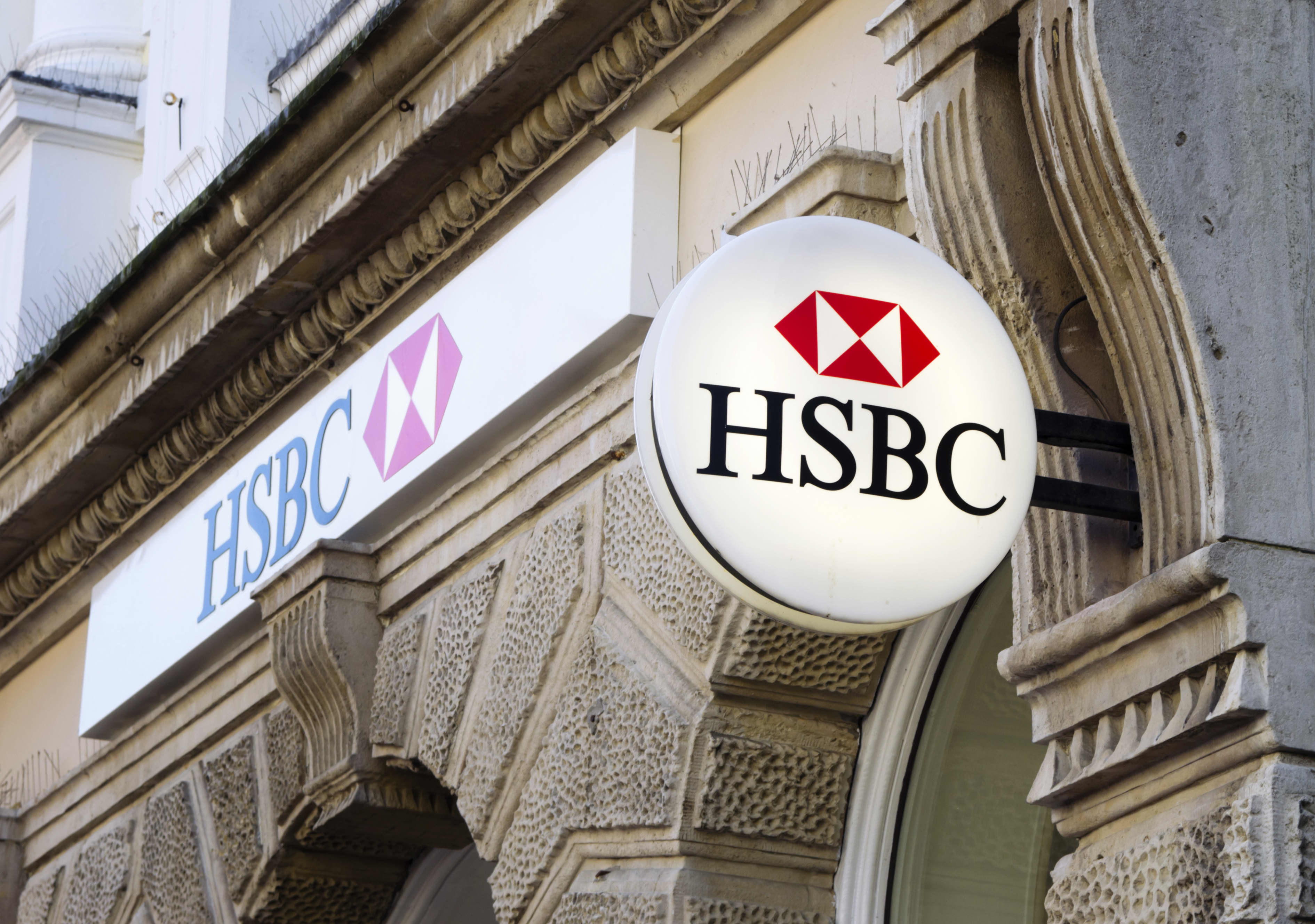 The HSBC bank logo on a building.