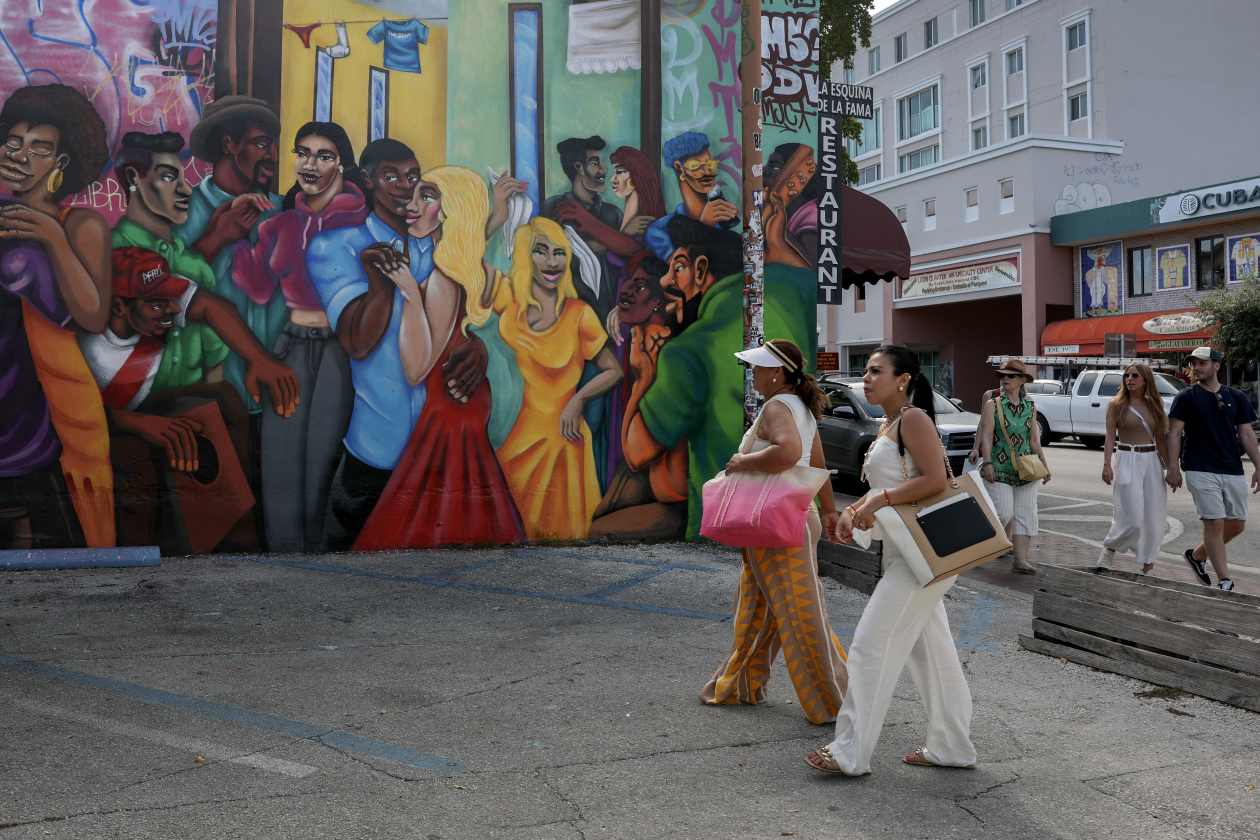 Visitors enjoy the sights in the Little Havana neighborhood in Miami, Florida. Yet tourism has taken a hit from a decline in foreign visitors because of U.S. trade wars.