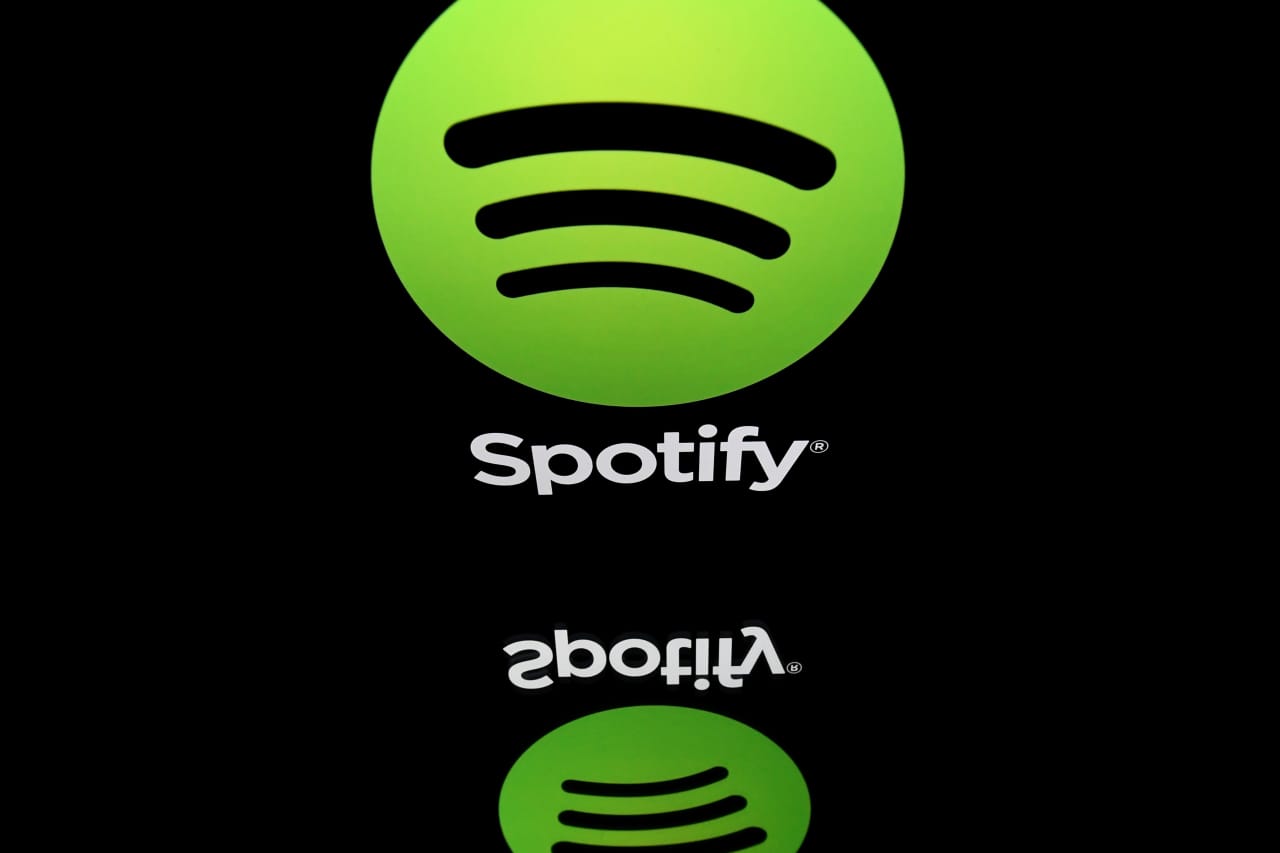 Spotify reports surprise loss as employee costs, weak dollar weigh