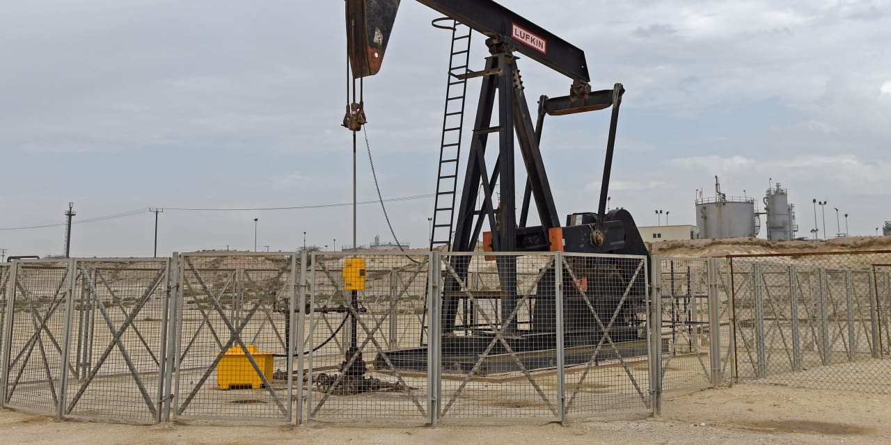 Oil climbs as upbeat economic data suggest stronger energy demand