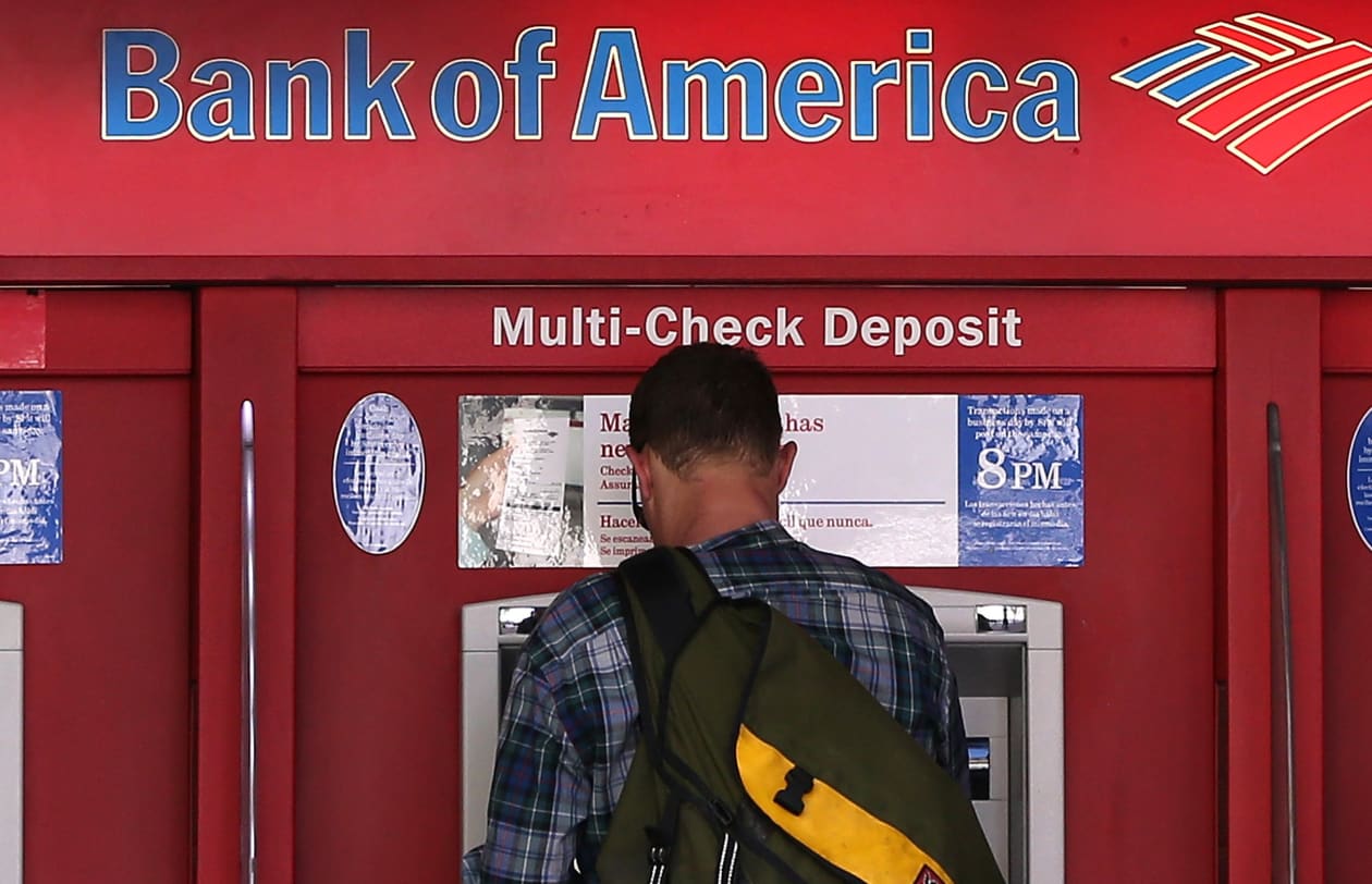 Bank of America’s stock slides 1% as earnings almost halve from a year ...
