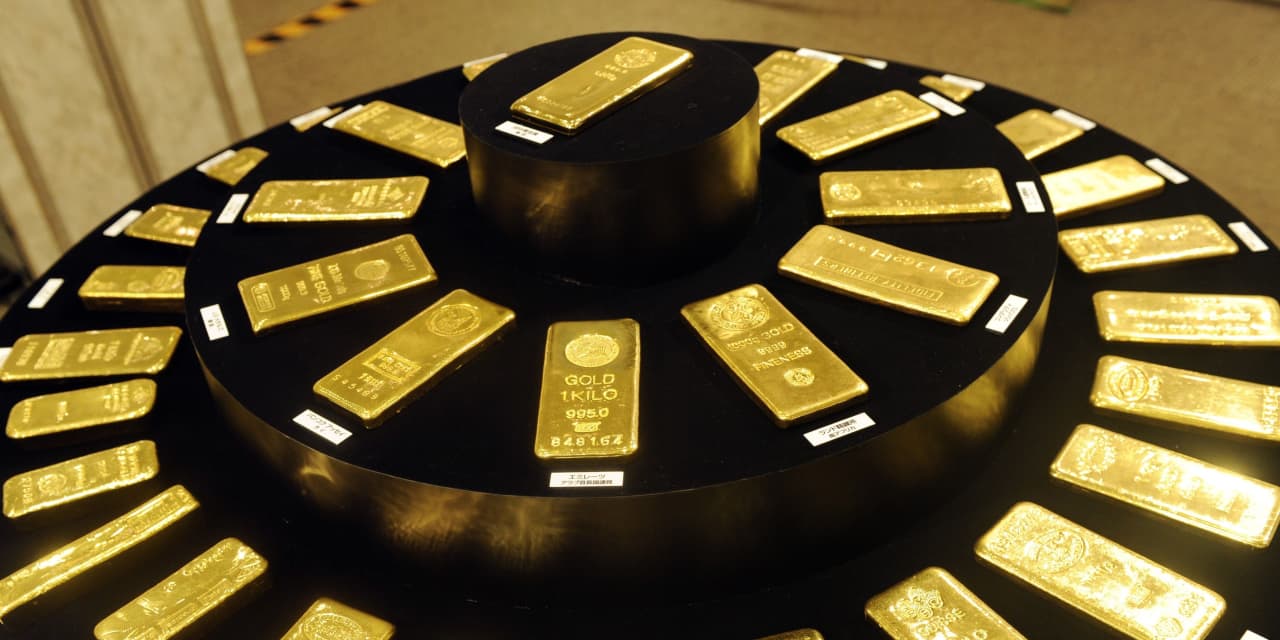 Gold prices go higher as the U.S. dollar declines to more than a 2 1/2-year low