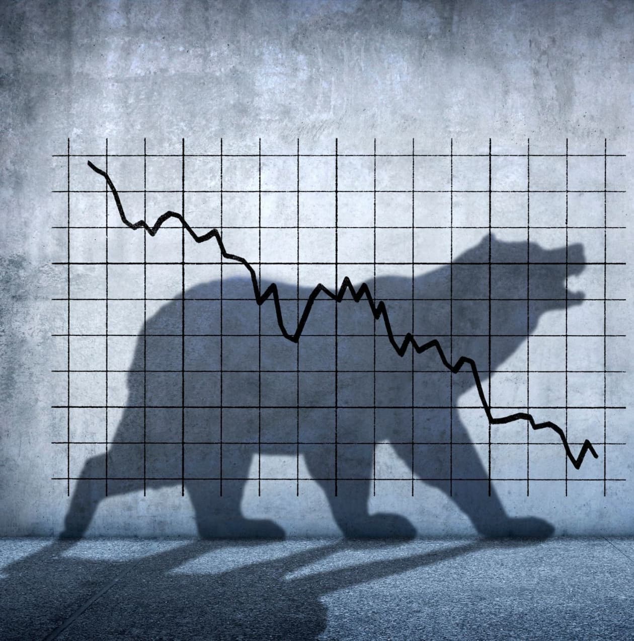 Illustration of a descending stock chart over the shadow of a bear, symbolizing a bear market.