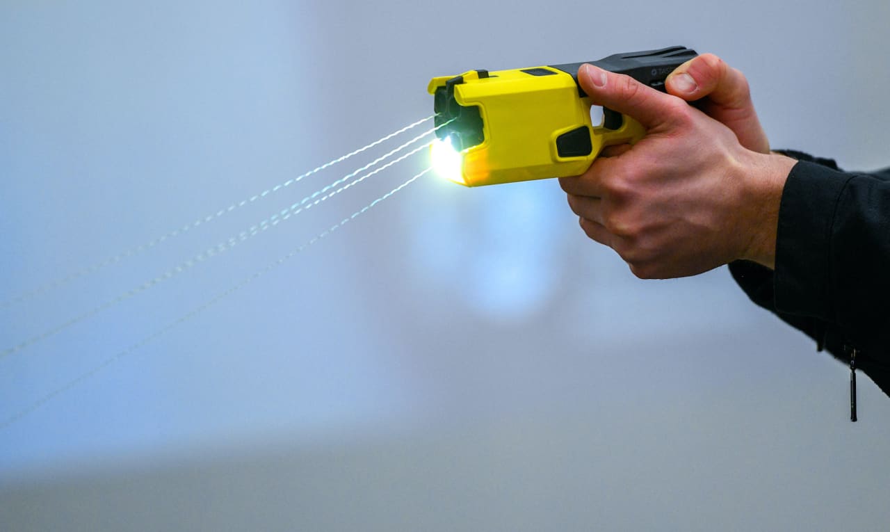 The maker of Taser stun guns says it’s becoming an AI company as bookings surge