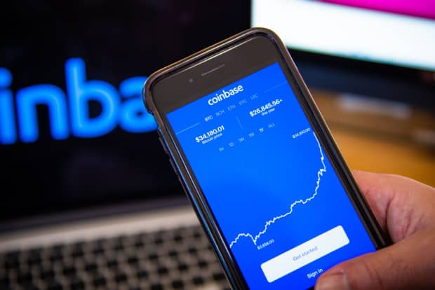 Coinbase stock pops after going public, with crypto ...