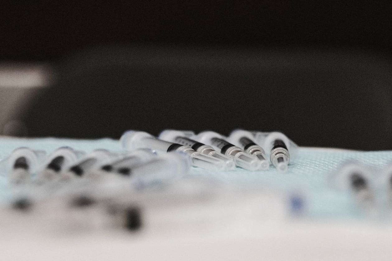 Johnson and Johnson's COVID-19 vaccine shots are prepared during a pop-up clinic in Detroit on Monday. GETTY IMAGES Rare blood clots tied to J&J's COVID-19 shot are similar to issues with AstraZeneca's vaccine, FDA official says