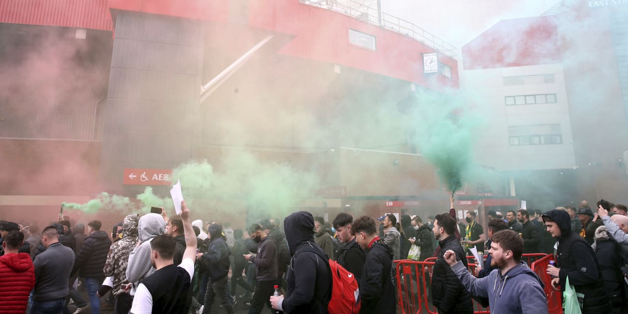 Manchester United match postponed after angry fans storm stadium to protest ownership