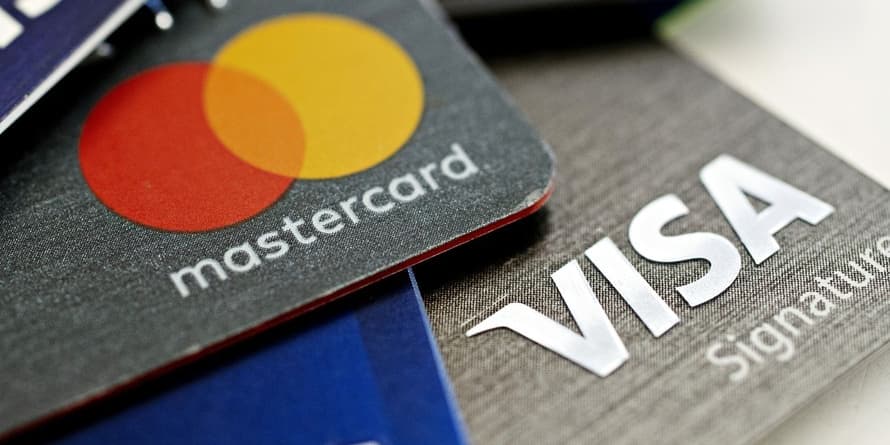 #: Visa, Mastercard say they will suspend Russia operations