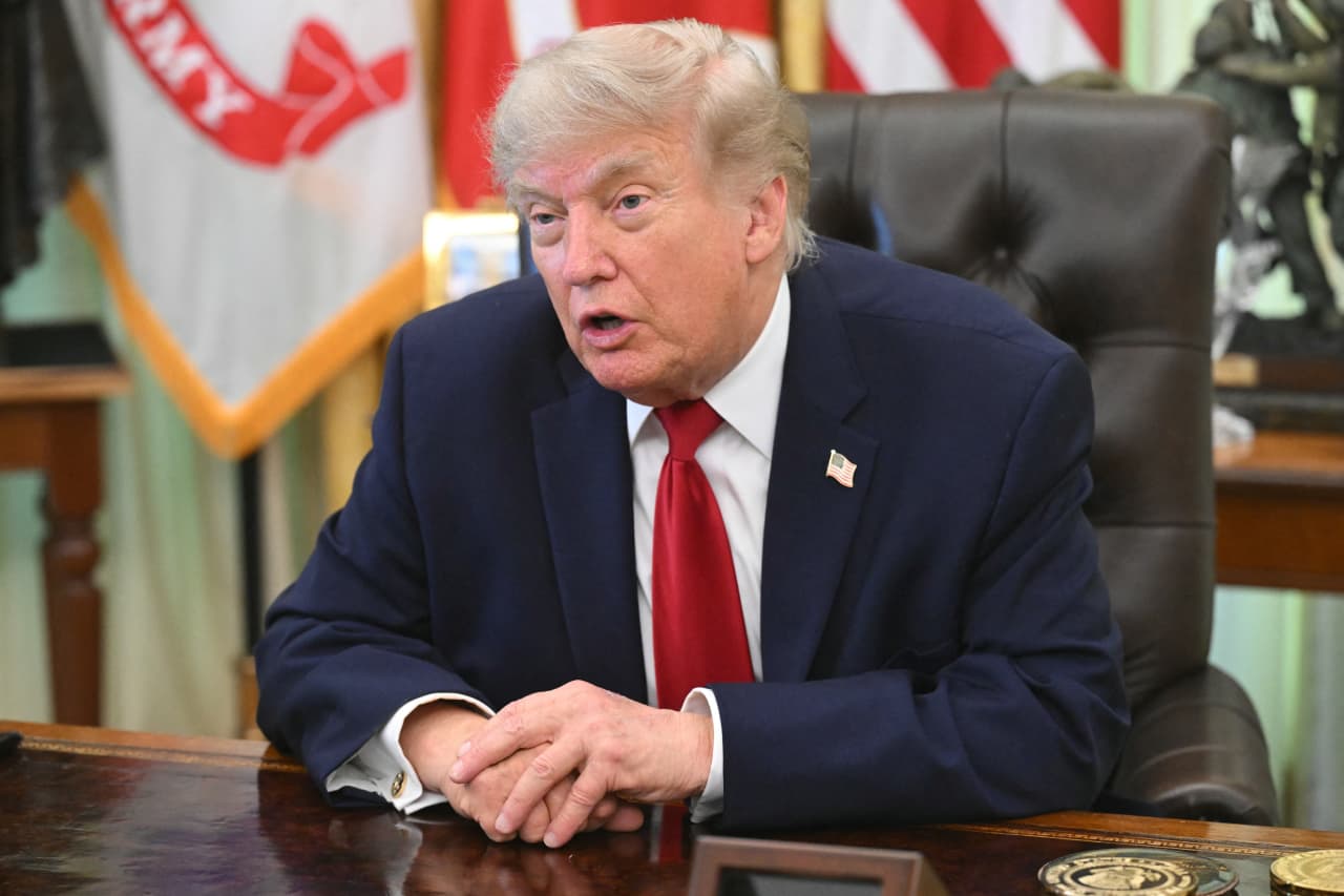 Trump rings Wall Street opening bells and says the stock market 'is going to go through the roof'