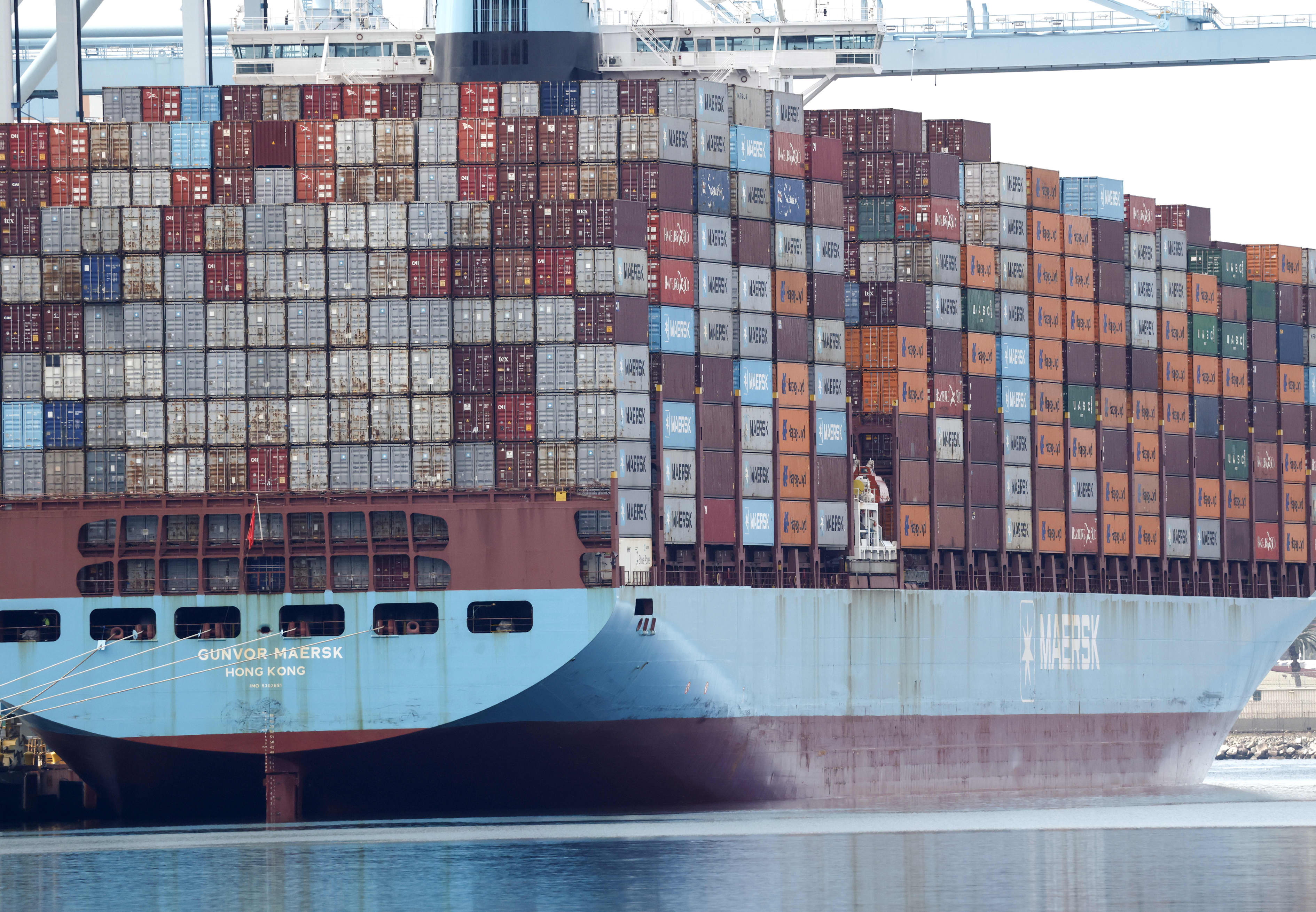 A large container ship, "Gunvor Maersk," loaded with shipping containers, at the Port of Los Angeles.