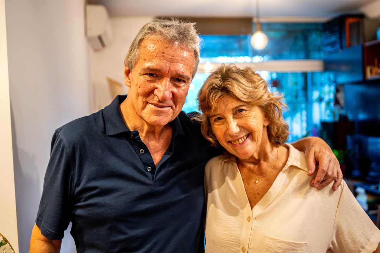 Portrait of a senior couple arm-in-arm.