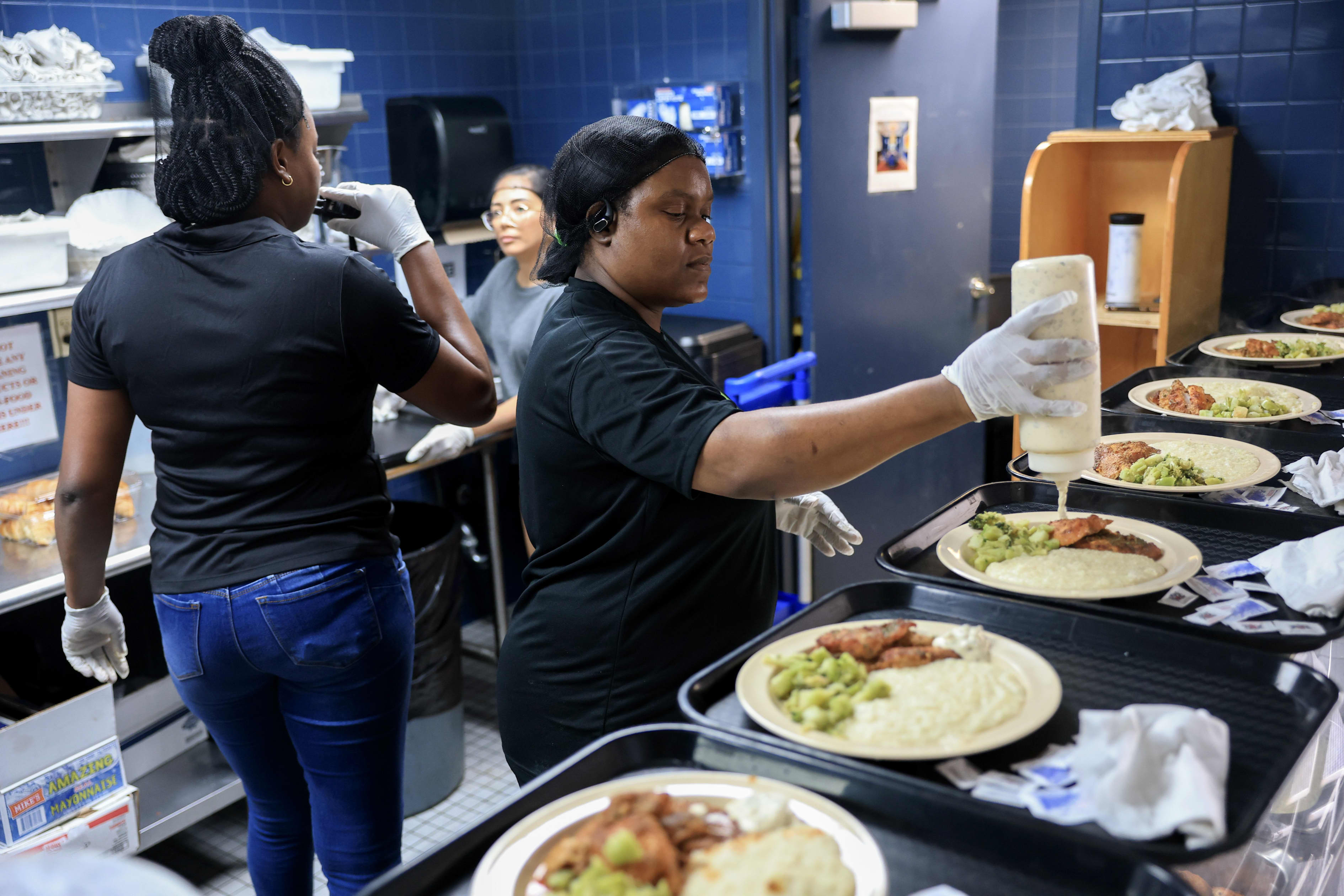 Odilia Kelly serves meals at the LifeNet4Families Community Cafe.