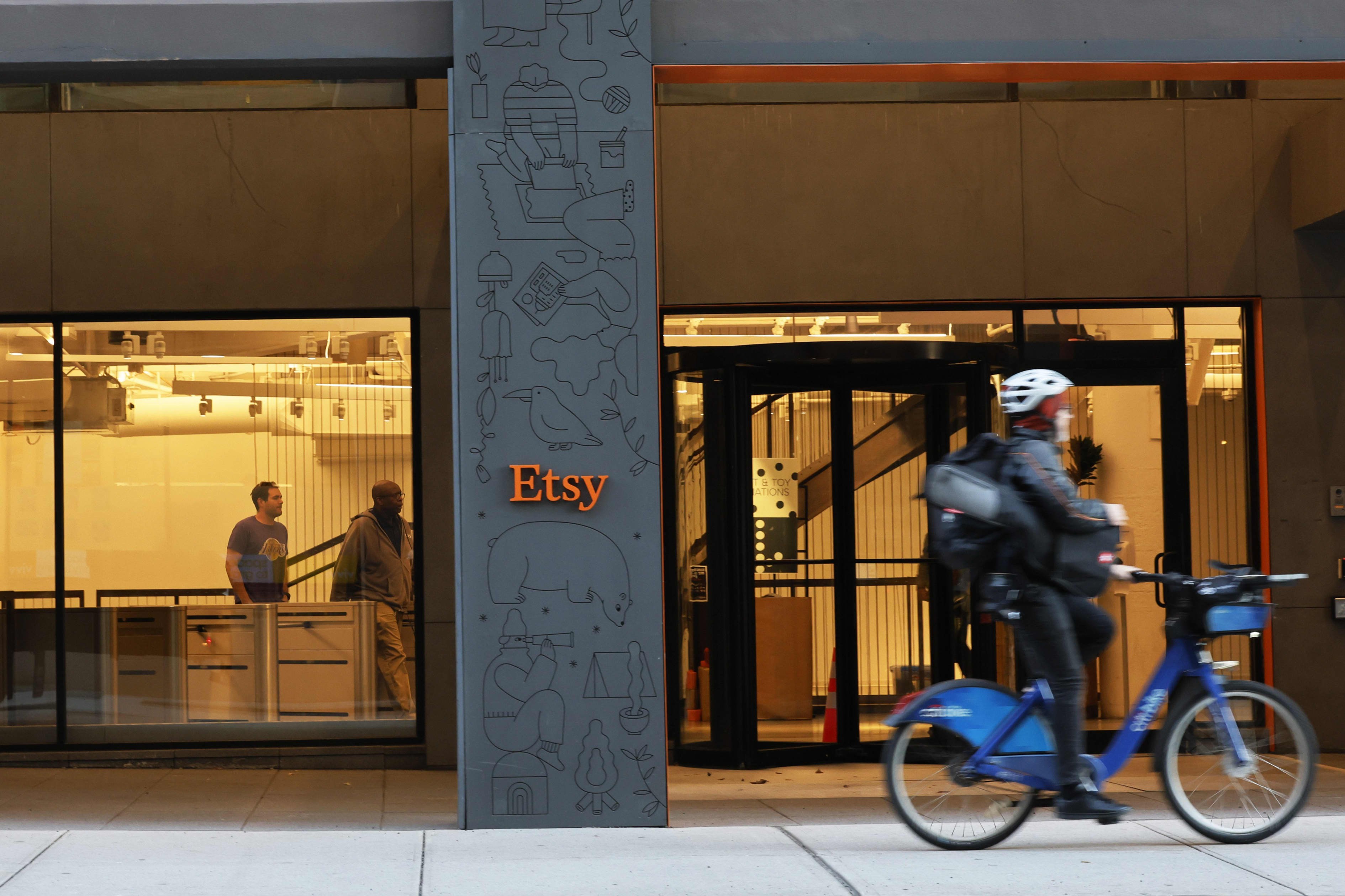 The Etsy headquarters building with a cyclist passing by.