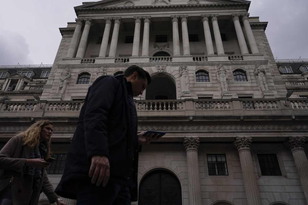 Pound drops to nearly 2-year low, despite Bank of England lifting key ...