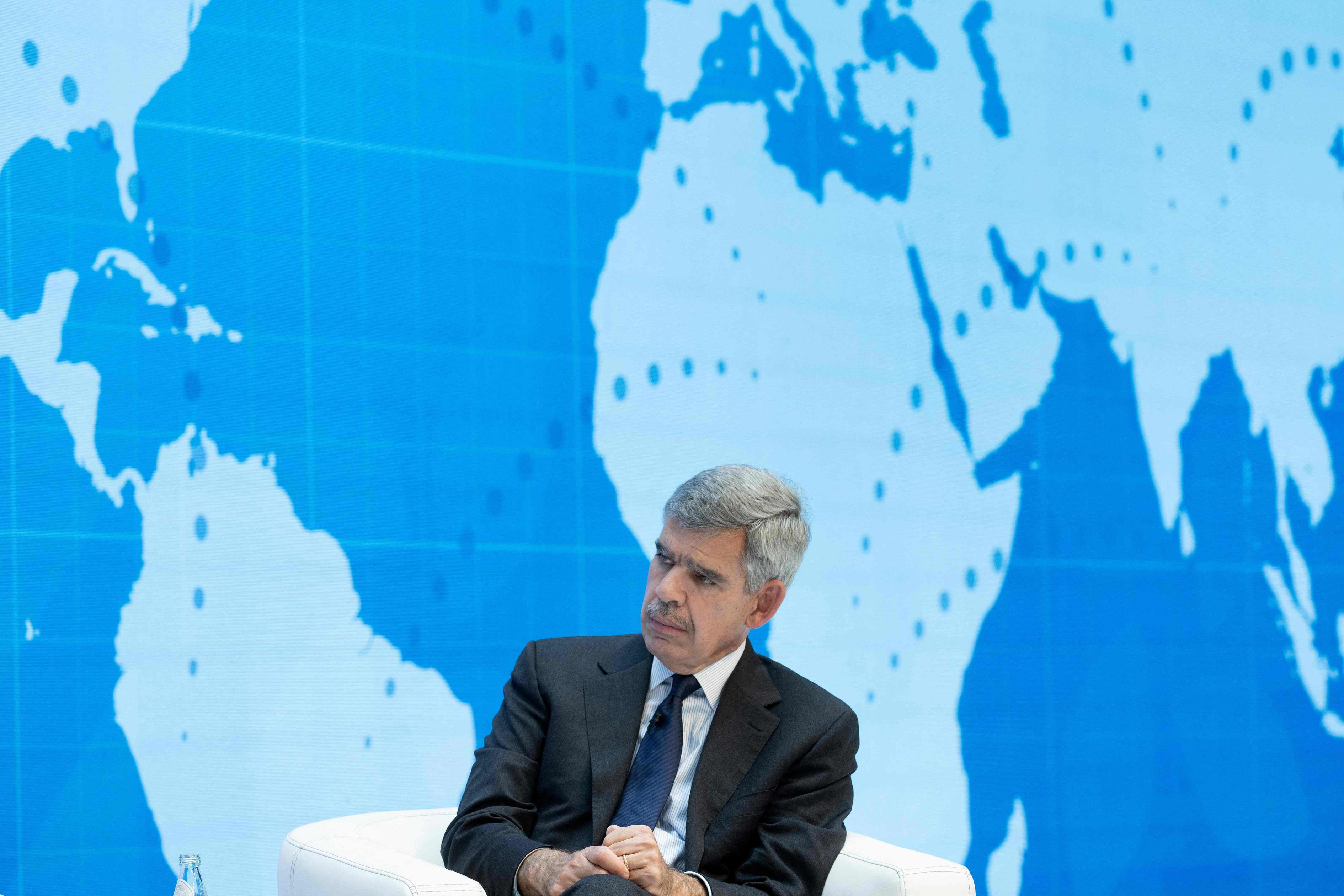 Mohamed El-Erian listening during a discussion about the global economy.