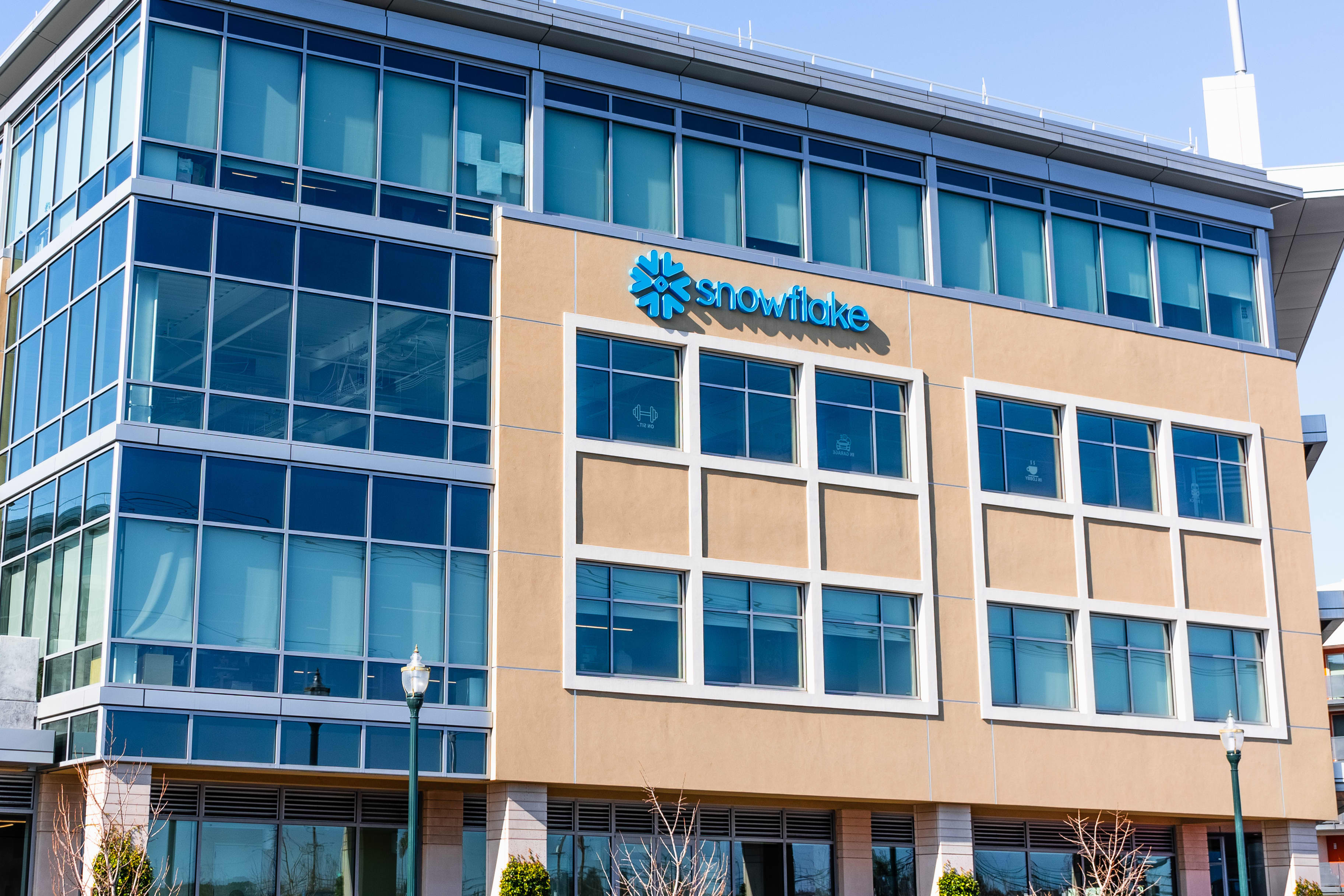 Snowflake corporate headquarters building with blue logo on a beige facade.