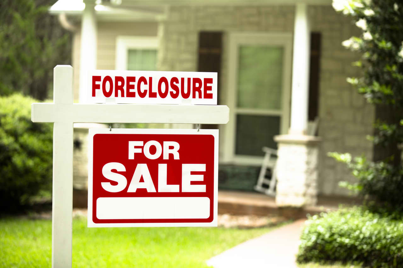 Foreclosures jump 20% as more people miss mortgage payments. ‘People are biting off more than they can chew.’