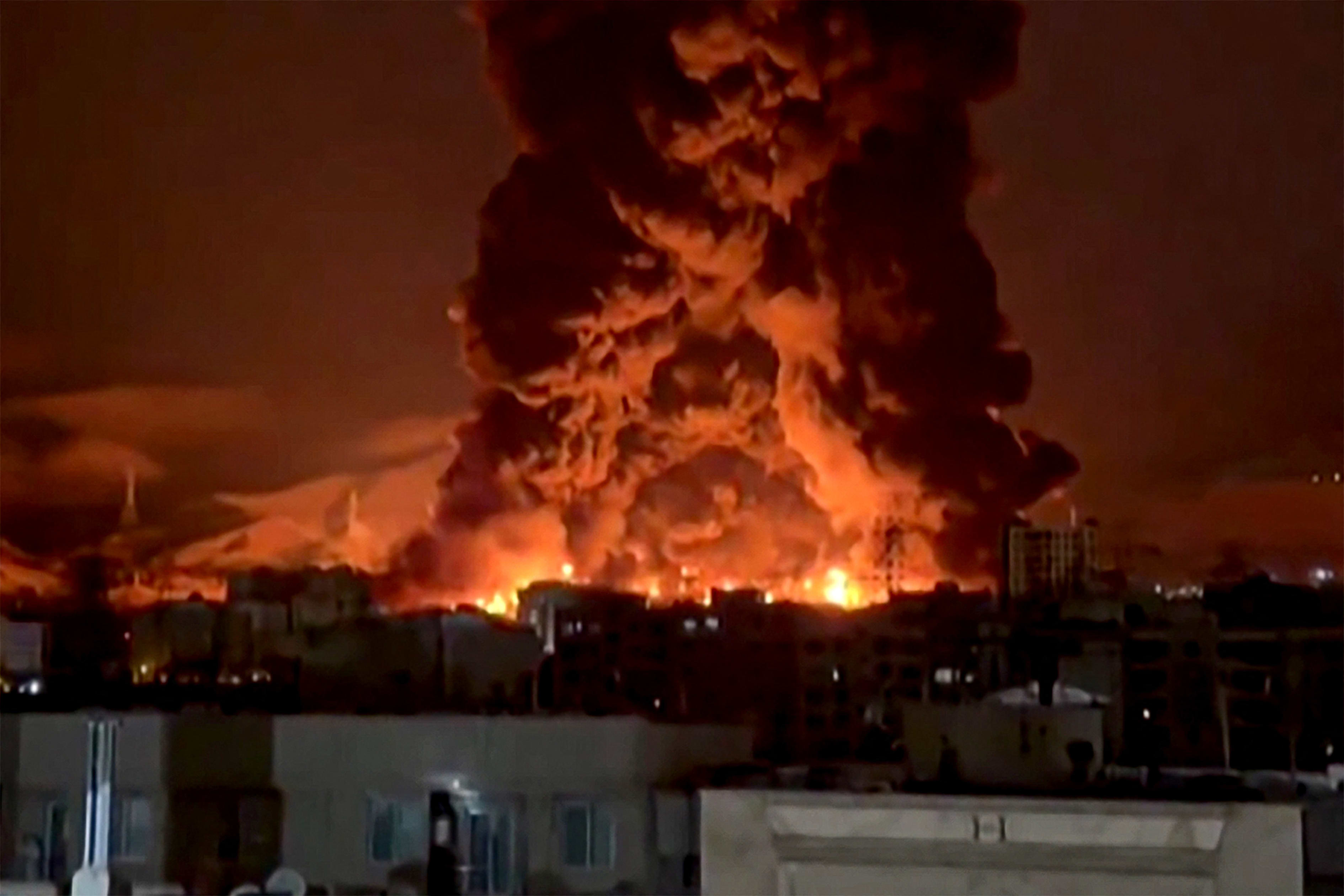 This video grab taken from UGC images posted on social media on March 7 and 8, 2026 shows fire erupting at an oil depot in Iran's capital Tehran. Oil prices soared to levels not seen since 2022 on Monday. 
