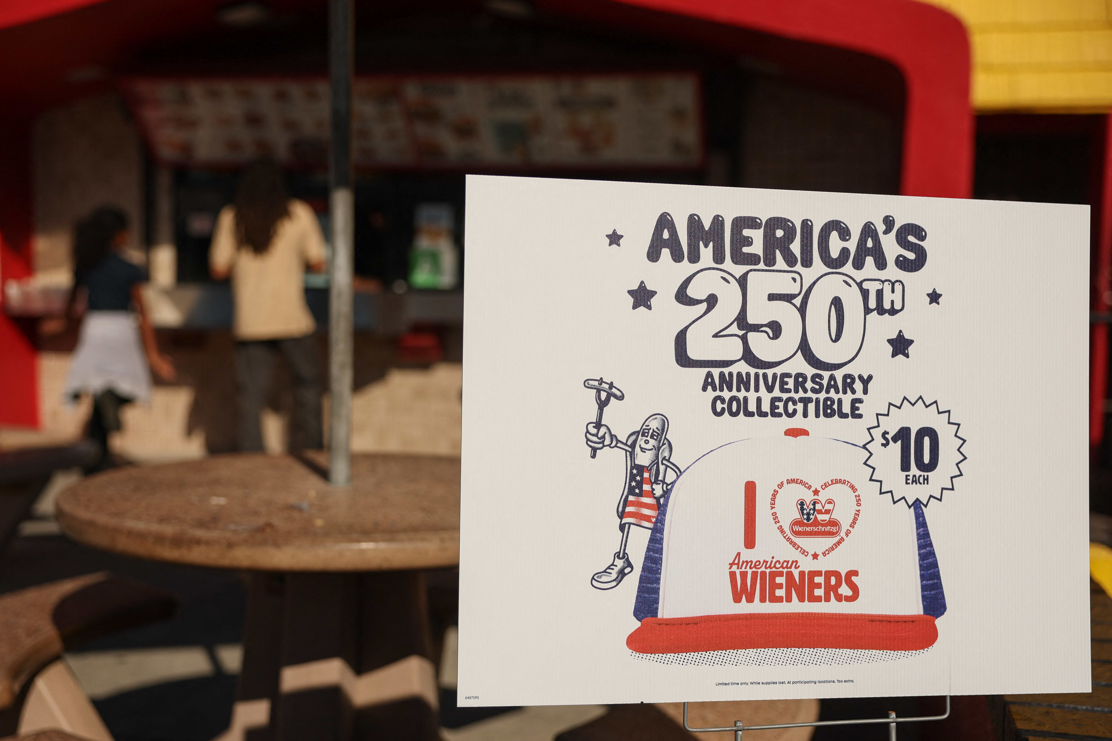 Customers wait for food orders outside the Wienerschnitzel American hot dog and fast food restaurant in Los Angeles.
