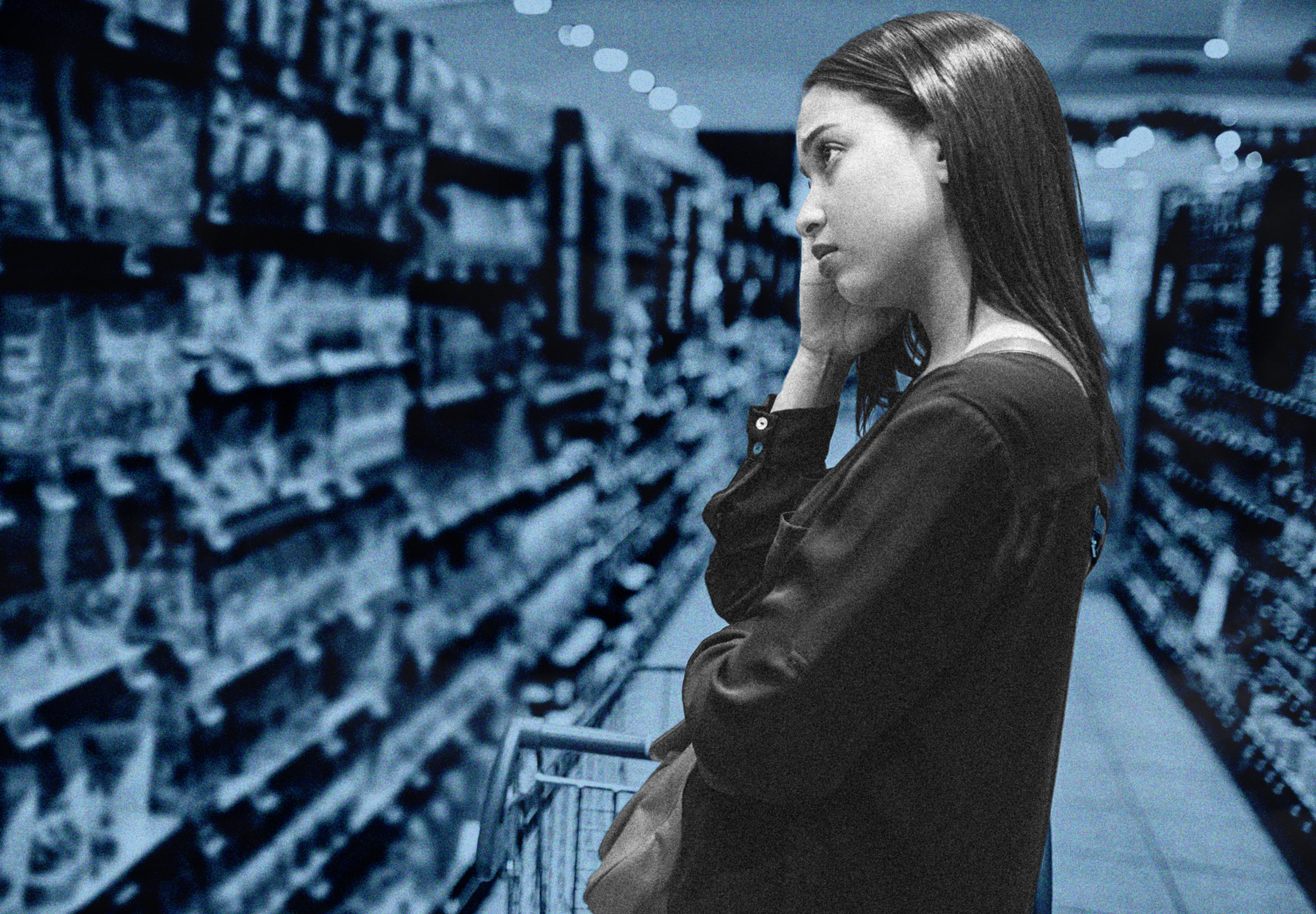 Woman looking worried while shopping in a grocery store.