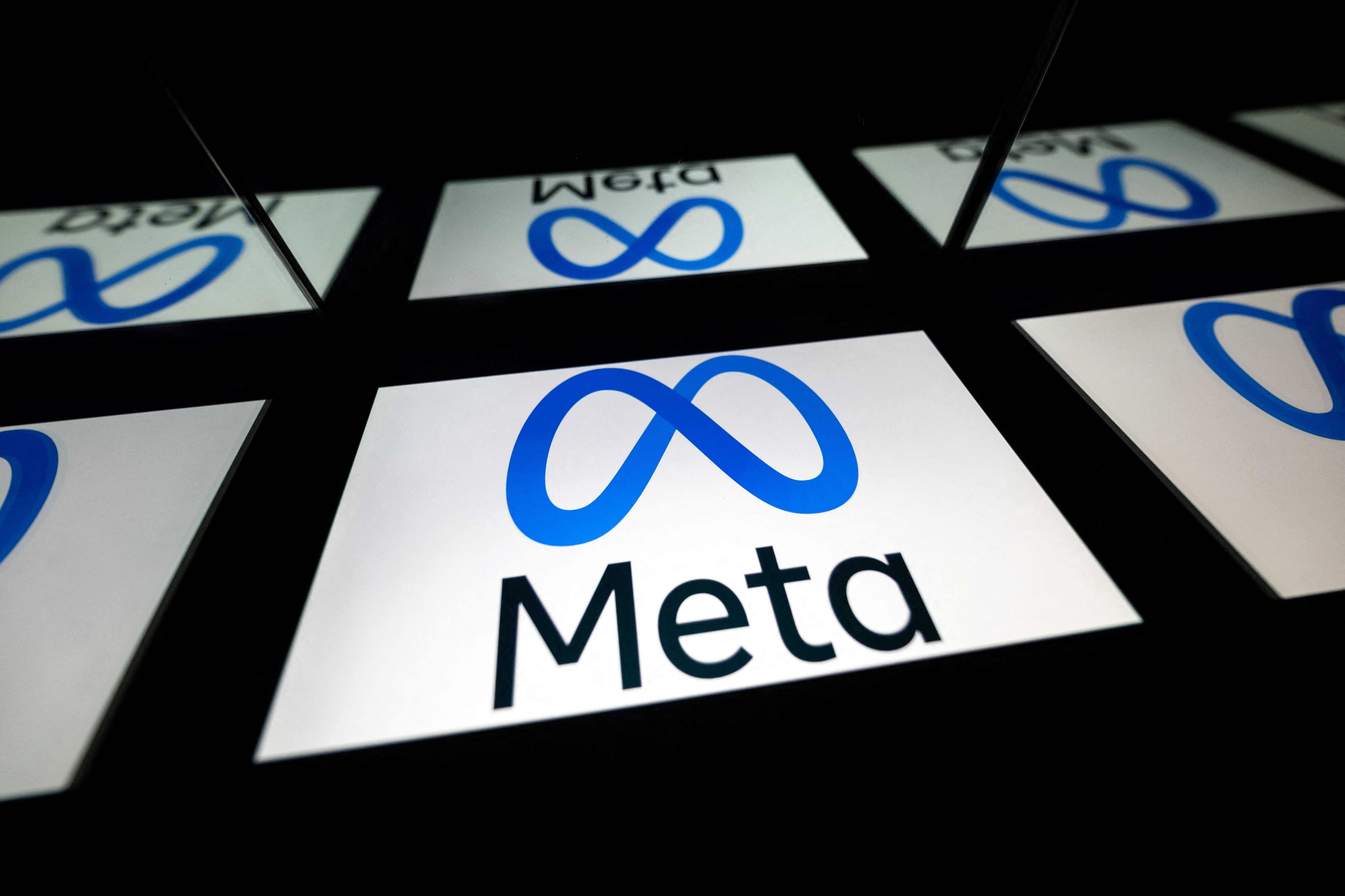 The Meta Platforms logo, a blue infinity symbol with the word "Meta" underneath, displayed on a tablet screen.