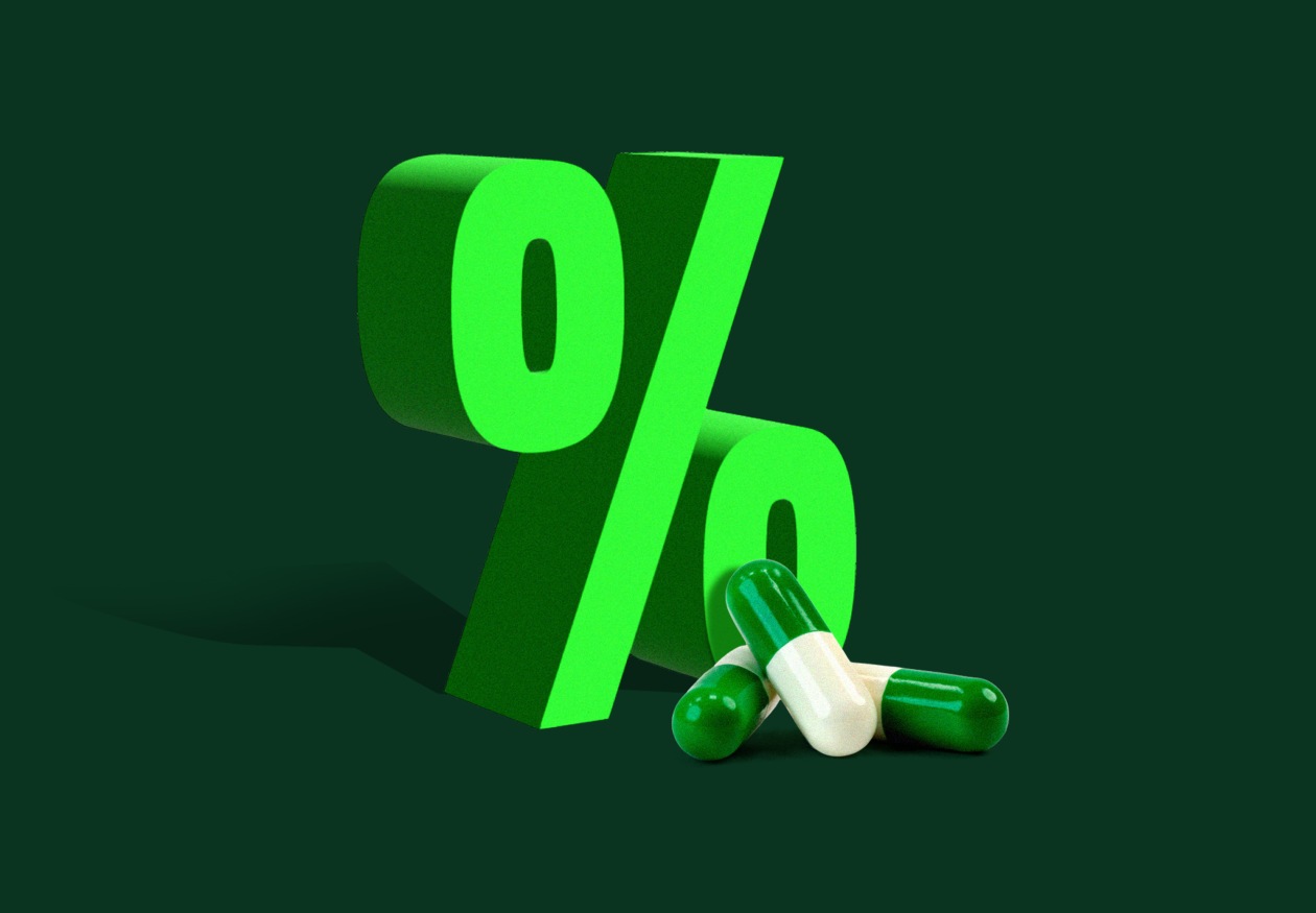 Illustration of a green percentage sign with two green and white pills.