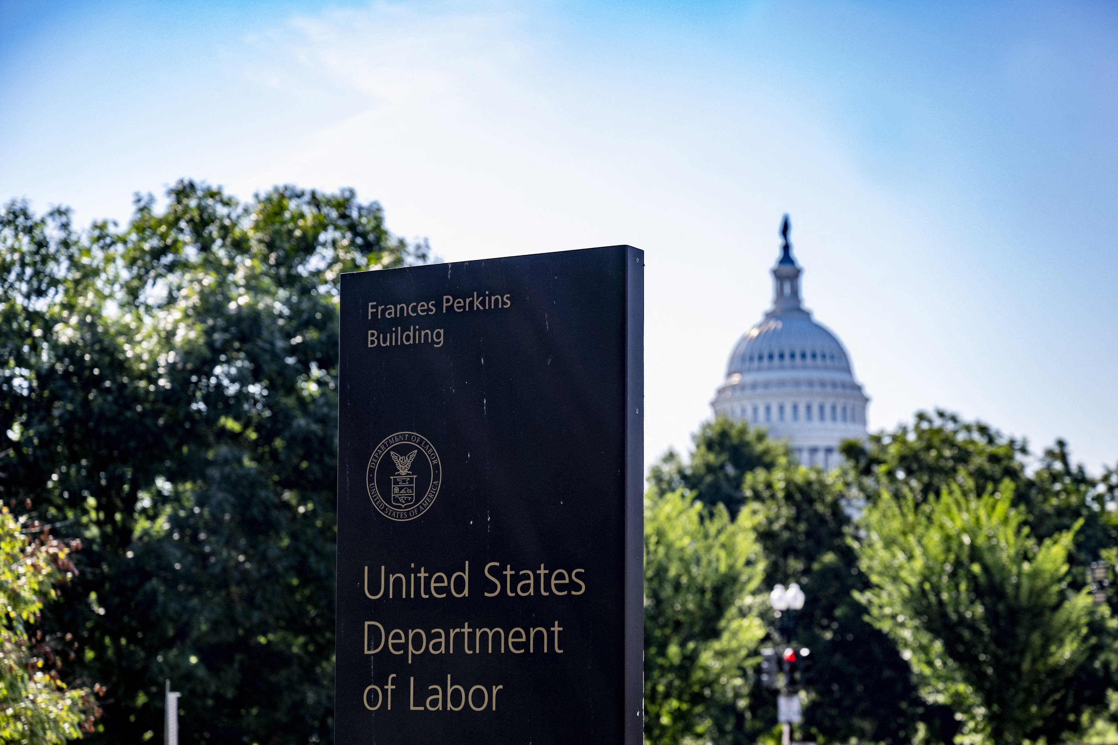 US Department of Labor sign with the US Capitol in the background.