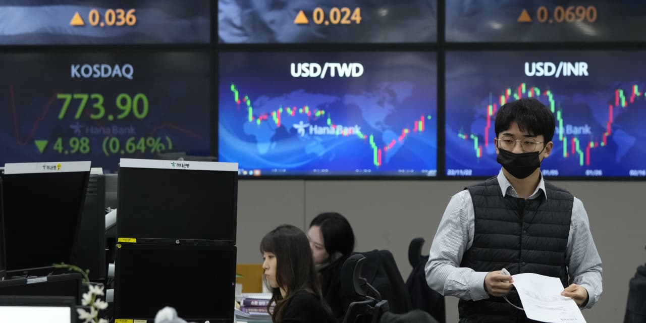 Asian shares follow Wall Street lower after stronger-than-expected data