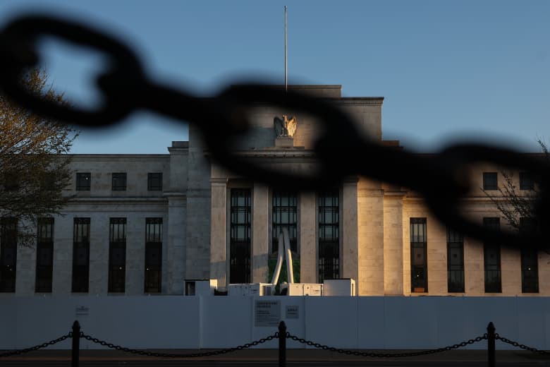 Powell says no interest-rate cuts in 2023, but the bond market isn't ...
