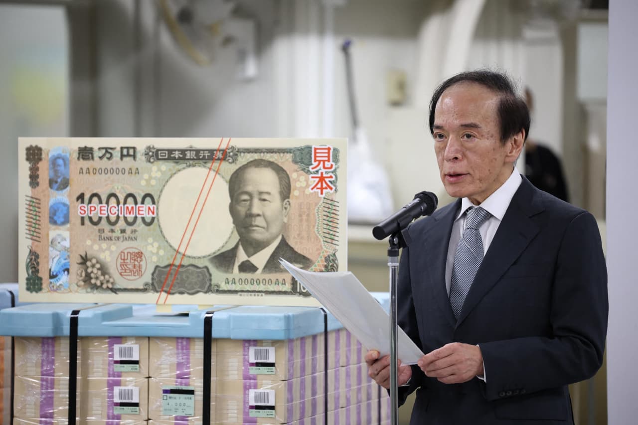 Yen surges to 150 per dollar after Bank of Japan hikes rates