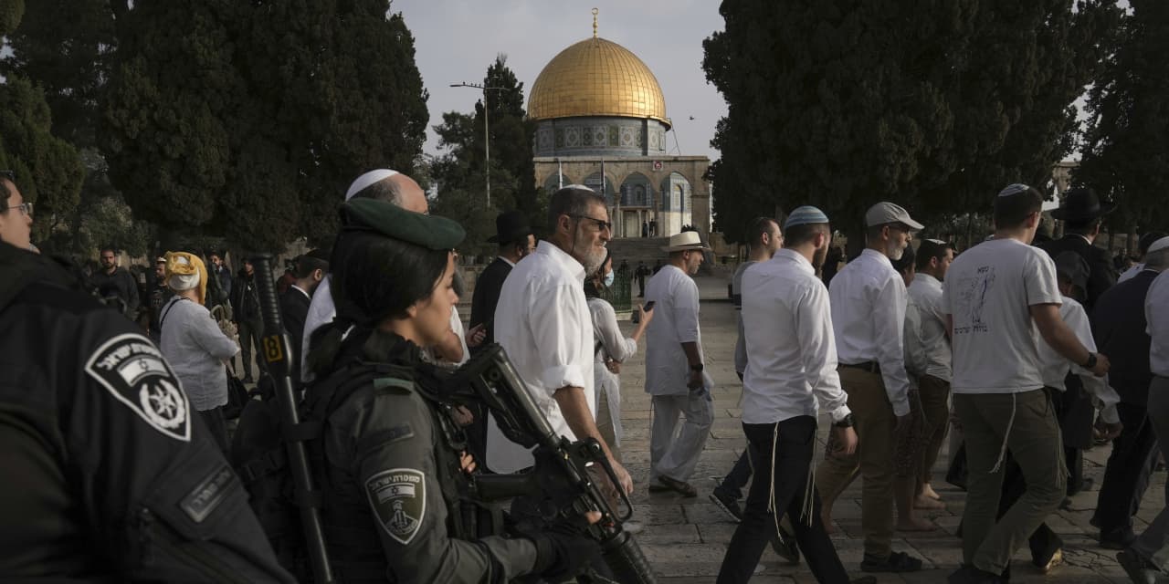 Tensions build around Jerusalem shrine as Israel strikes targets in Syria