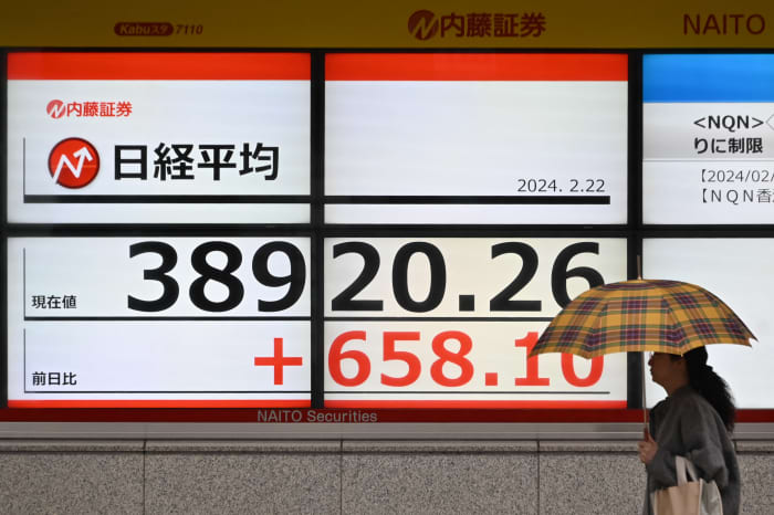 Japan s benchmark index closes at new record above 39 000 for best