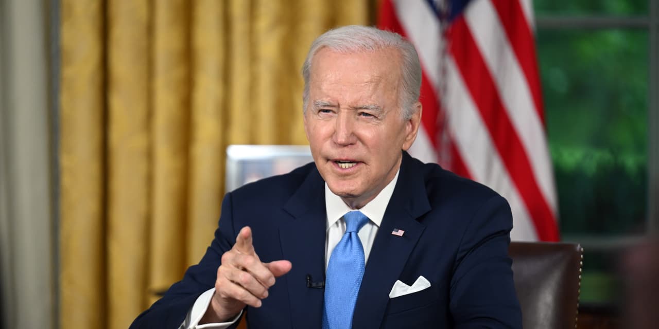 Biden signs debt ceiling bill that pulls U.S. back from brink of unprecedented default