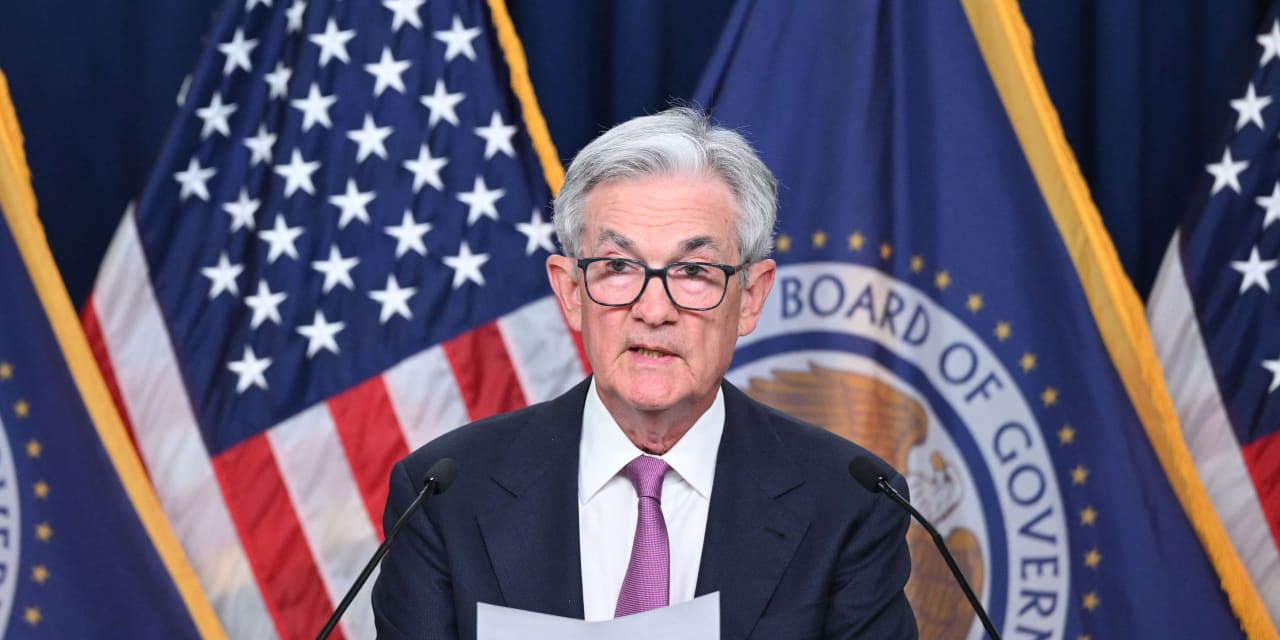 U.S. stocks end mixed on Fed decision to hold interest rates steady but ...