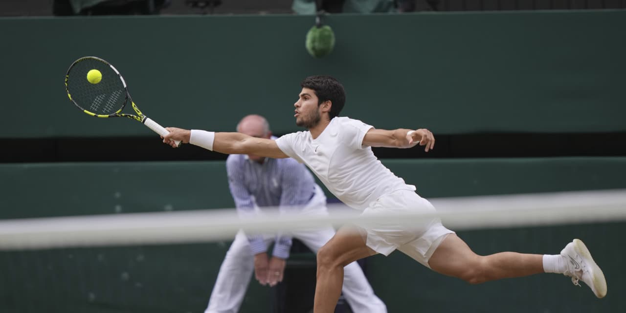 Carlos Alcaraz beats Novak Djokovic in five sets to win Wimbledon for his second major tennis trophy