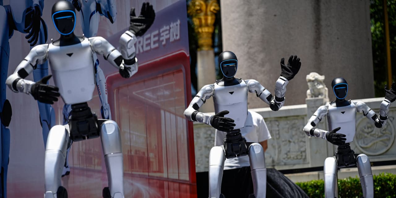 Trump signs an executive order on AI after it’s scaled back. Critics says it’s almost meaningless.