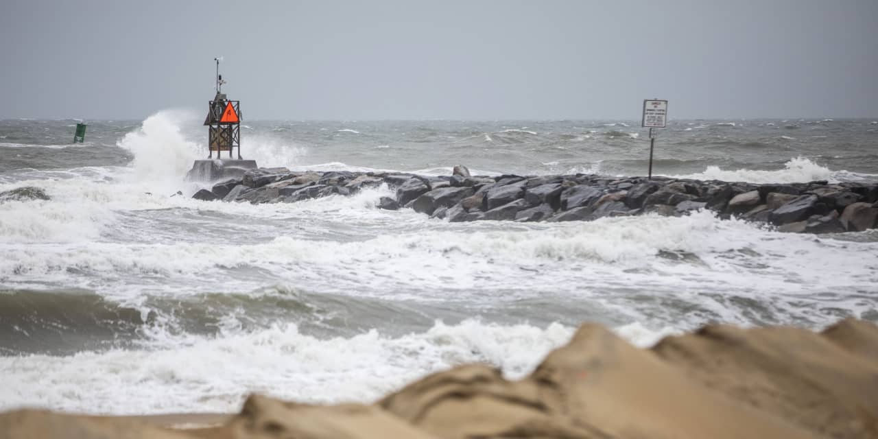 Tropical Storm Ophelia moves inland over North Carolina as coastal areas lashed with wind, rain