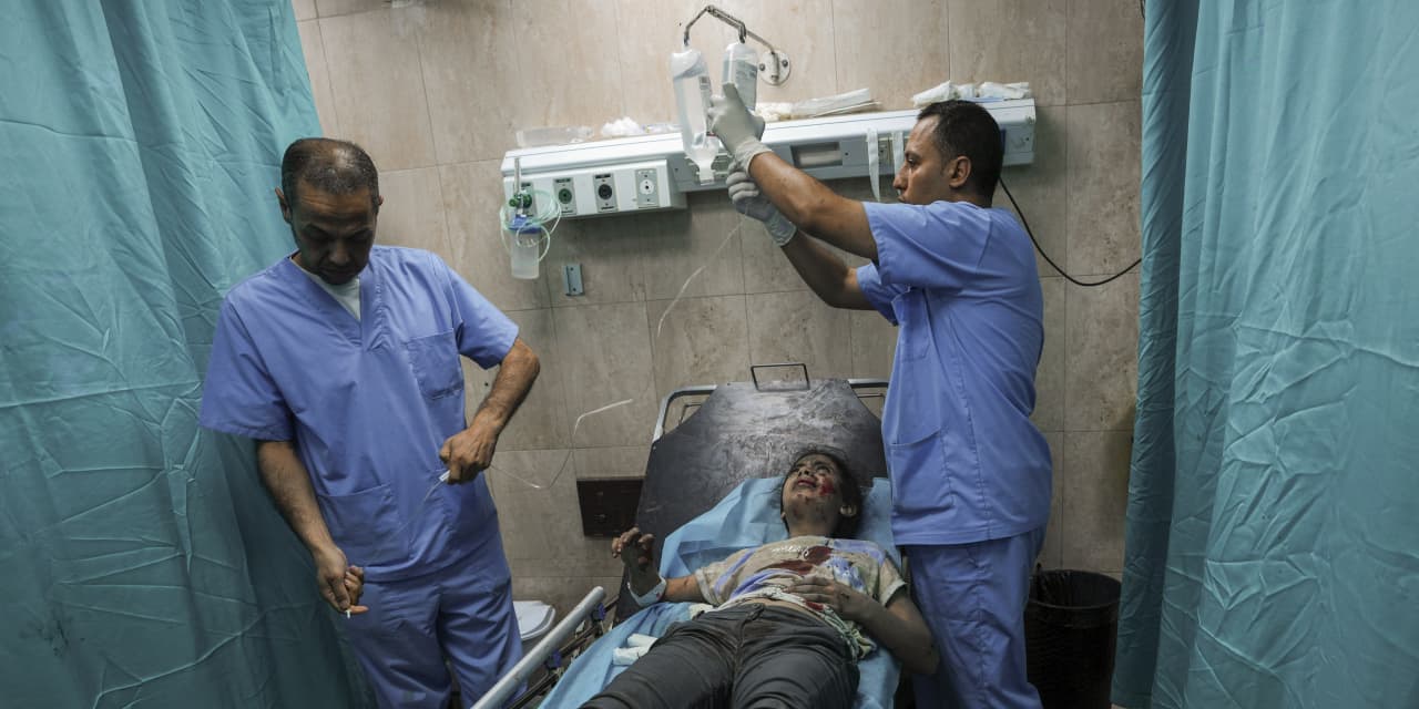 Gaza hospitals overwhelmed with patients, low on supplies as Israeli invasion looms