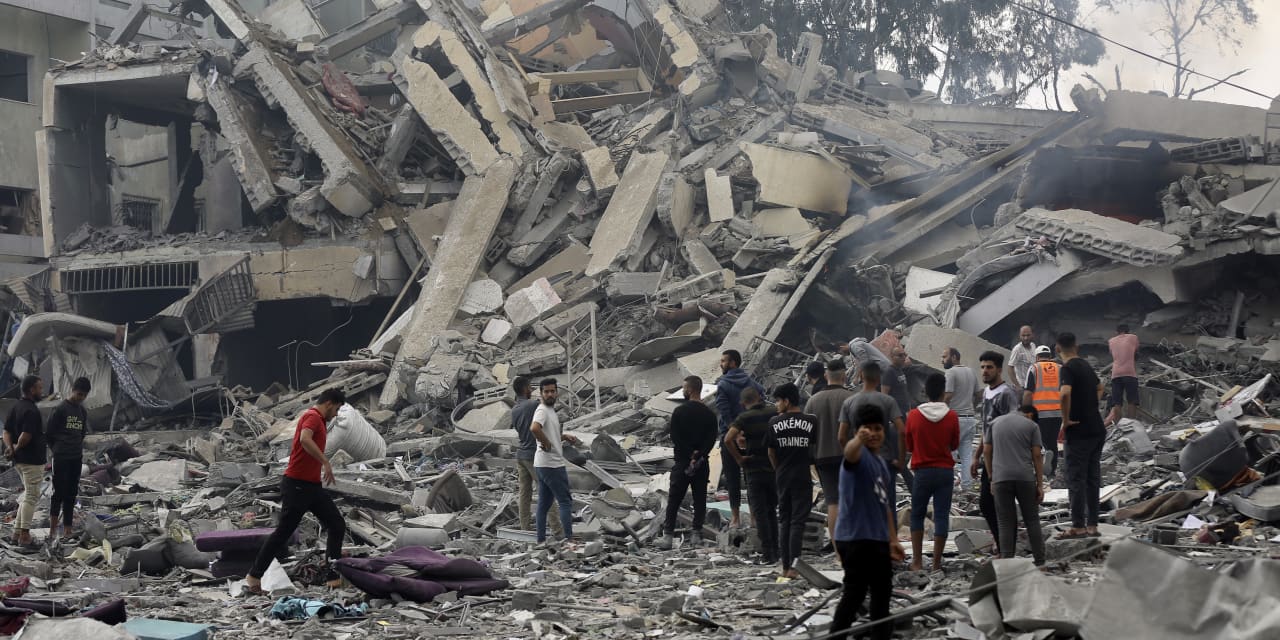 As Israel readies troops for ground assault, Gaza awaits urgently needed aid from Egypt