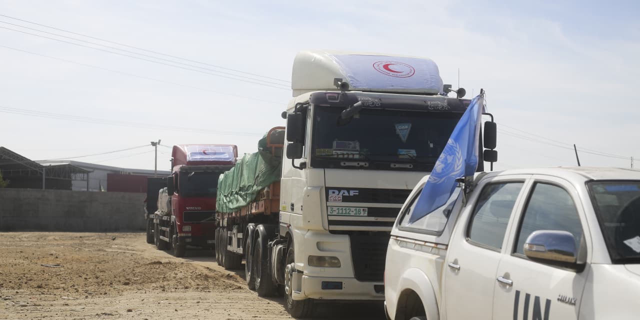 Egypt’s border crossing opens to let a trickle of desperately needed aid into besieged Gaza